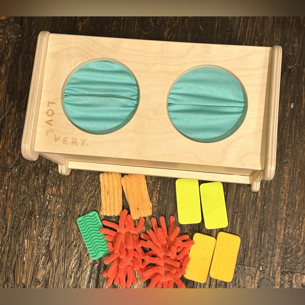 Lovevery Wooden Sensory Toy with Blue and Yellow Accents